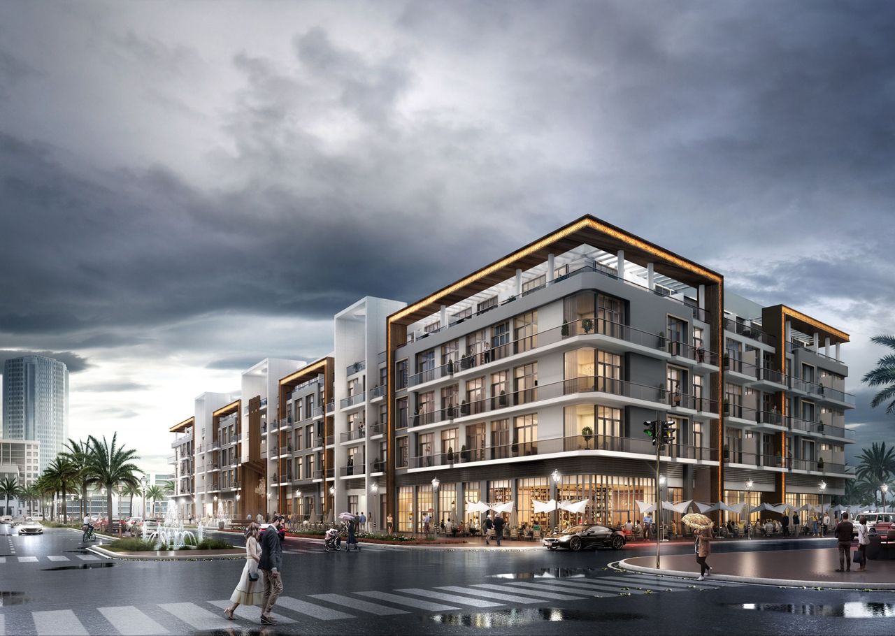 Pantheon Elysée I by PANTHEON Development | Daytime exterior view of the building with waterfront walkway in JVC Dubai